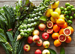 a group of fruits and vegetables on a wood surface Healthy Weight Loss Diets Solihull