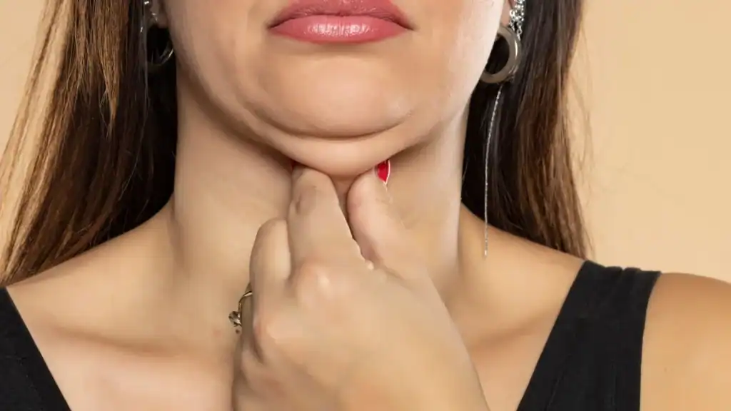 An image of a woman with double chin, sad, worried : Non Surgical Double Chin Removal Treatment in Solihull, UK